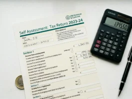 UK corporation tax rate 2025/26 — tax document, calculator and pen on a white desk