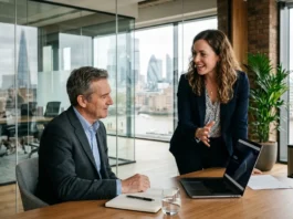 How to Find Angel Investors in the UK: A Founder’s Guide UK startup founder pitching to an angel investor in a London office meeting