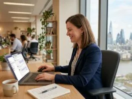 Small business owner using ChatGPT on a laptop in a UK office